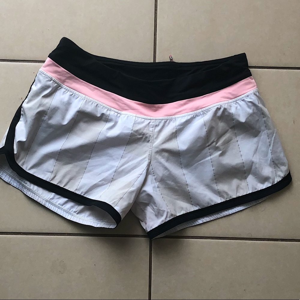 Lululemon speed running shorts. Pink, black with built in underwear.